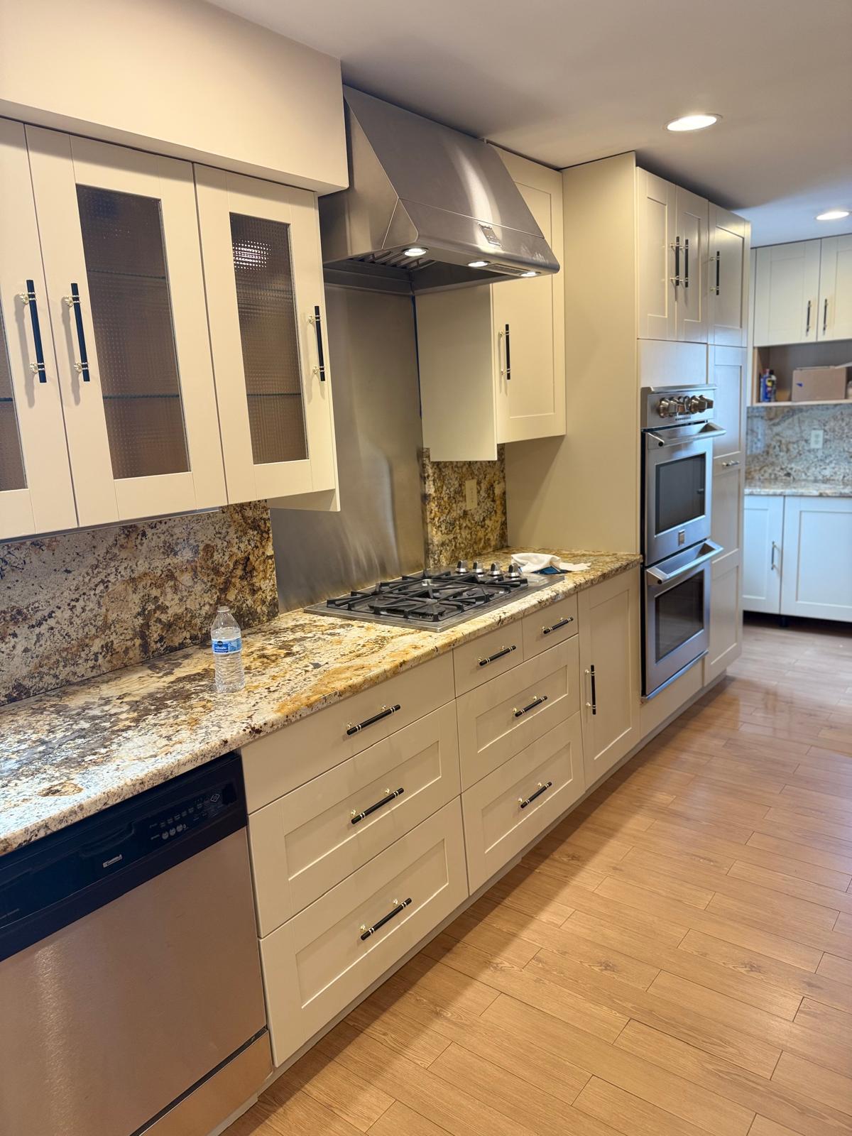 Custom kitchen remodeling with modern cabinets, granite countertops, and hardwood flooring